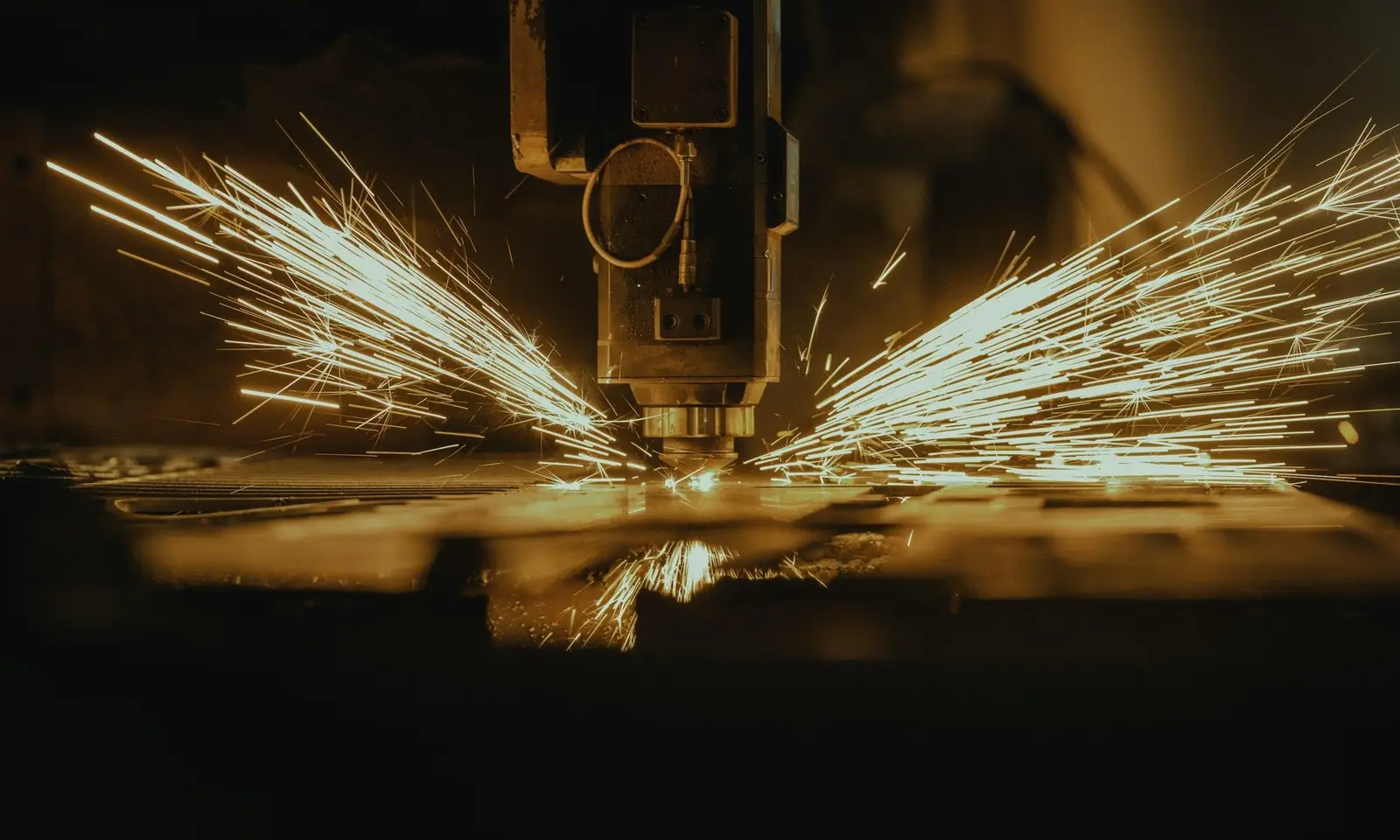 Fiber laser cutting steel sheet with sparks