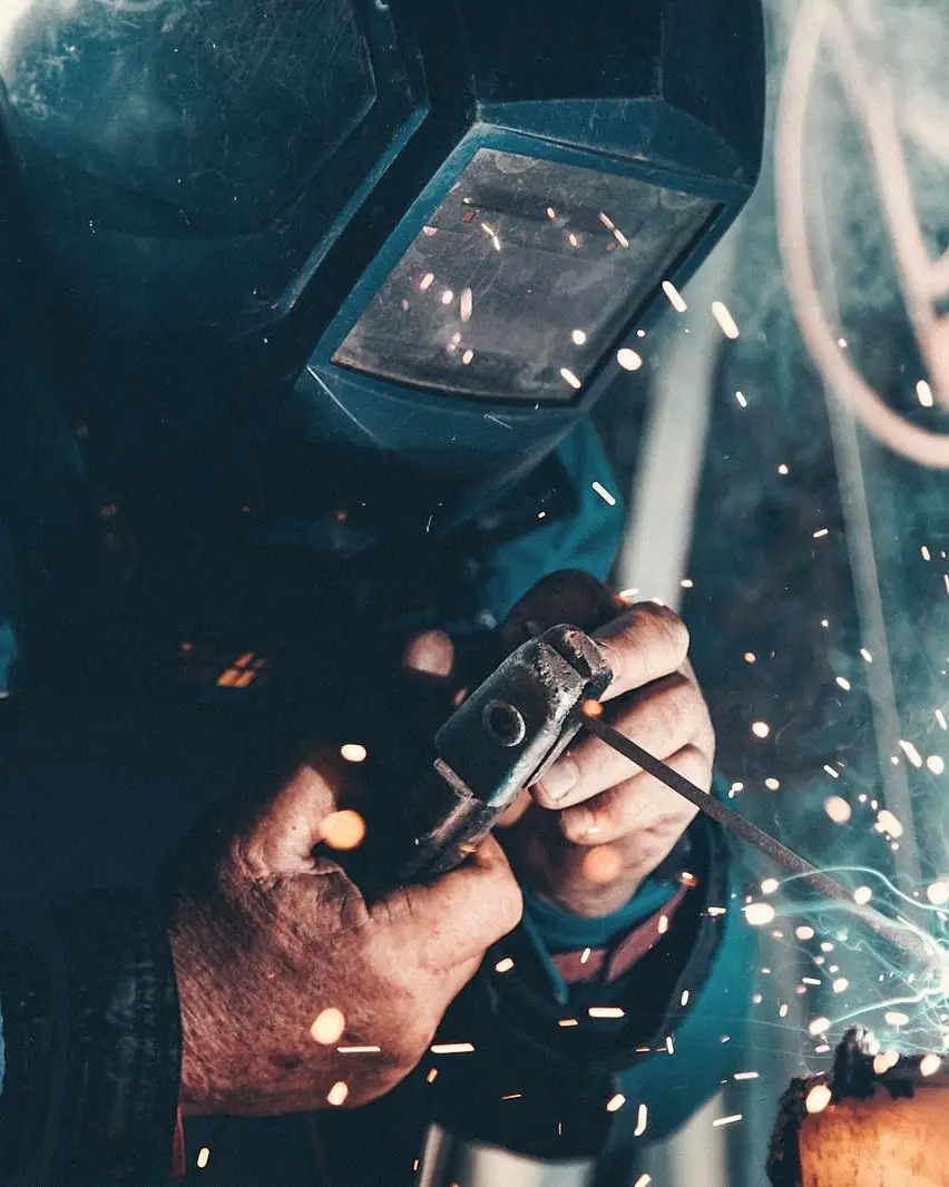 Welder fabricating a sheet metal assembly